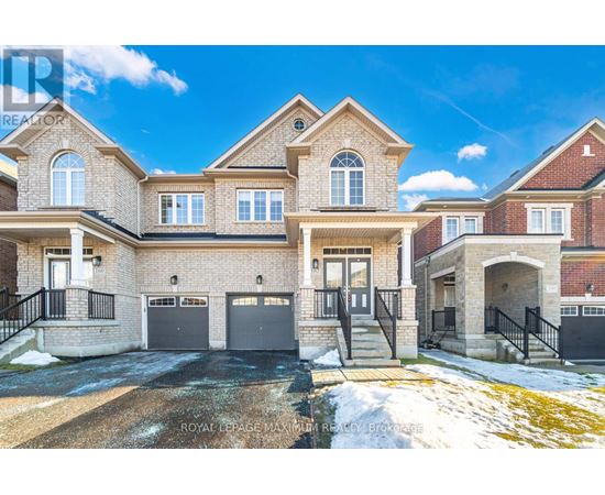 A large, two-story house with a garage is situated in a residential area.
