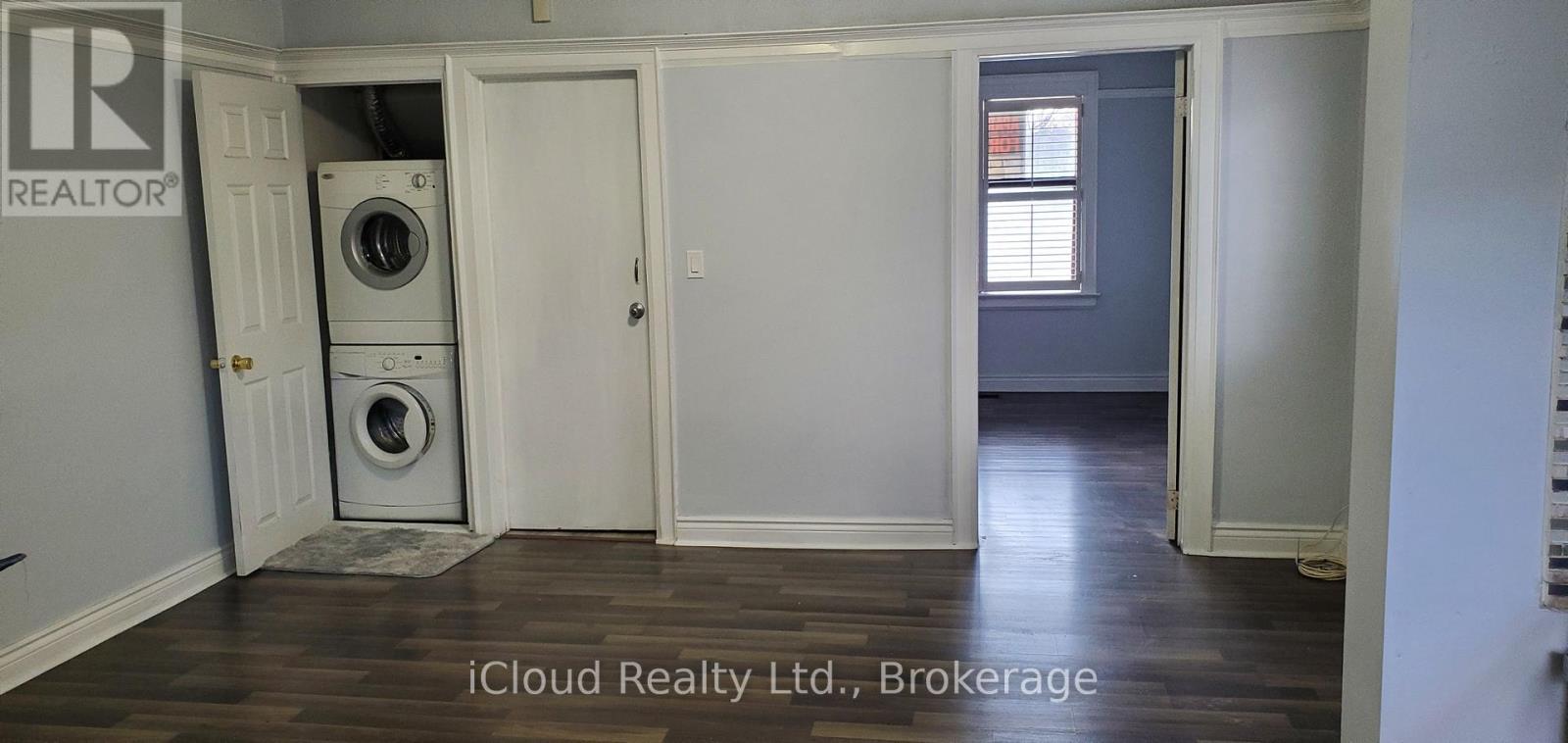 A room with a washer and dryer in it.