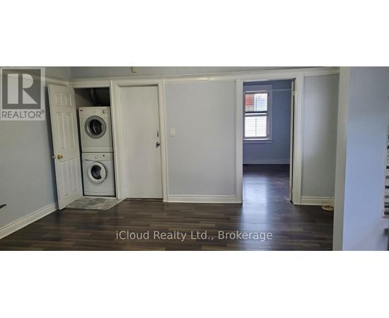 A room with a washer and dryer in it.