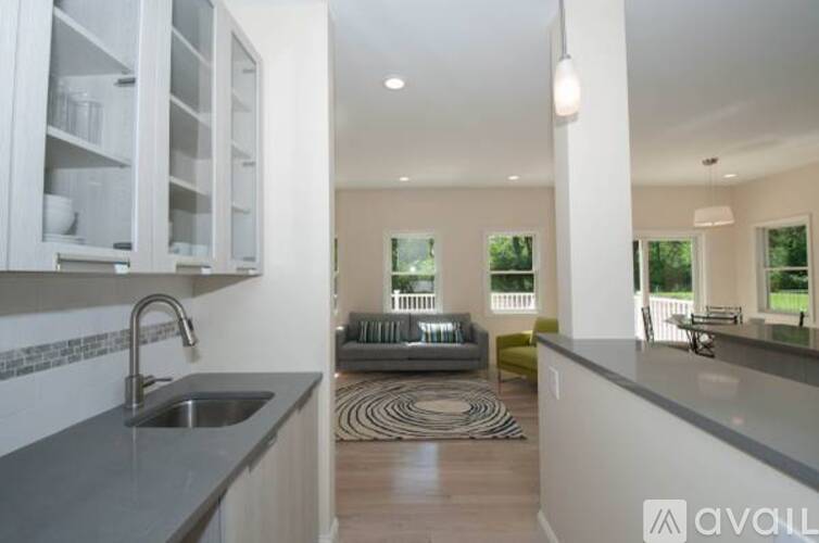A modern kitchen with a sink and a countertop.