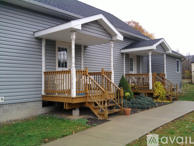 A house with a porch and a covered entrance.
