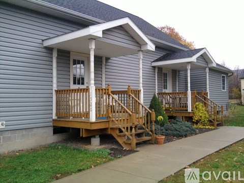 A house with a porch and a covered entrance.