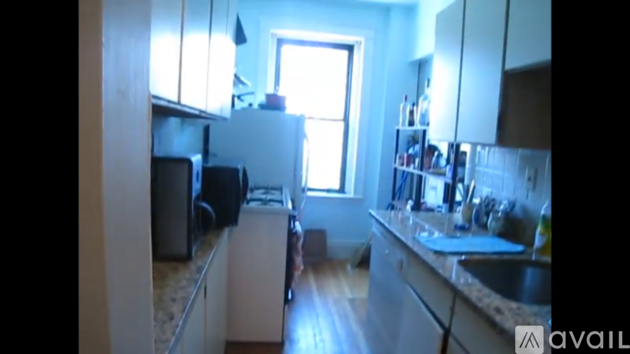 A kitchen with a sink and a window.