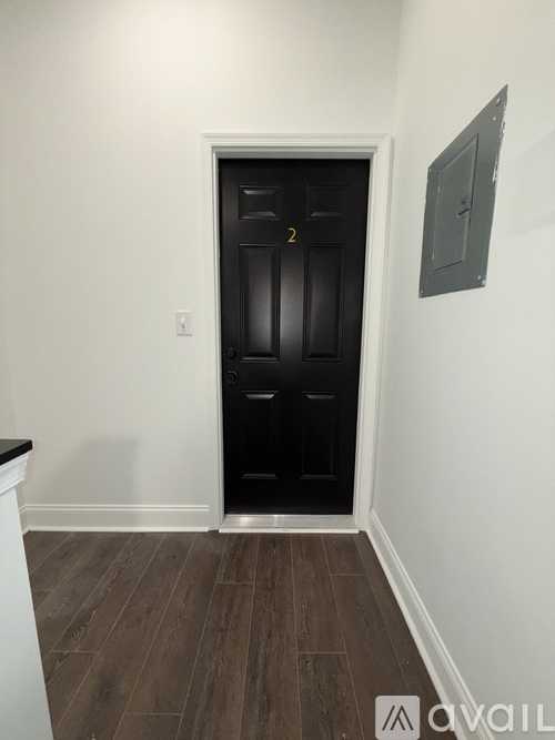 A black door with the number 2 on it.