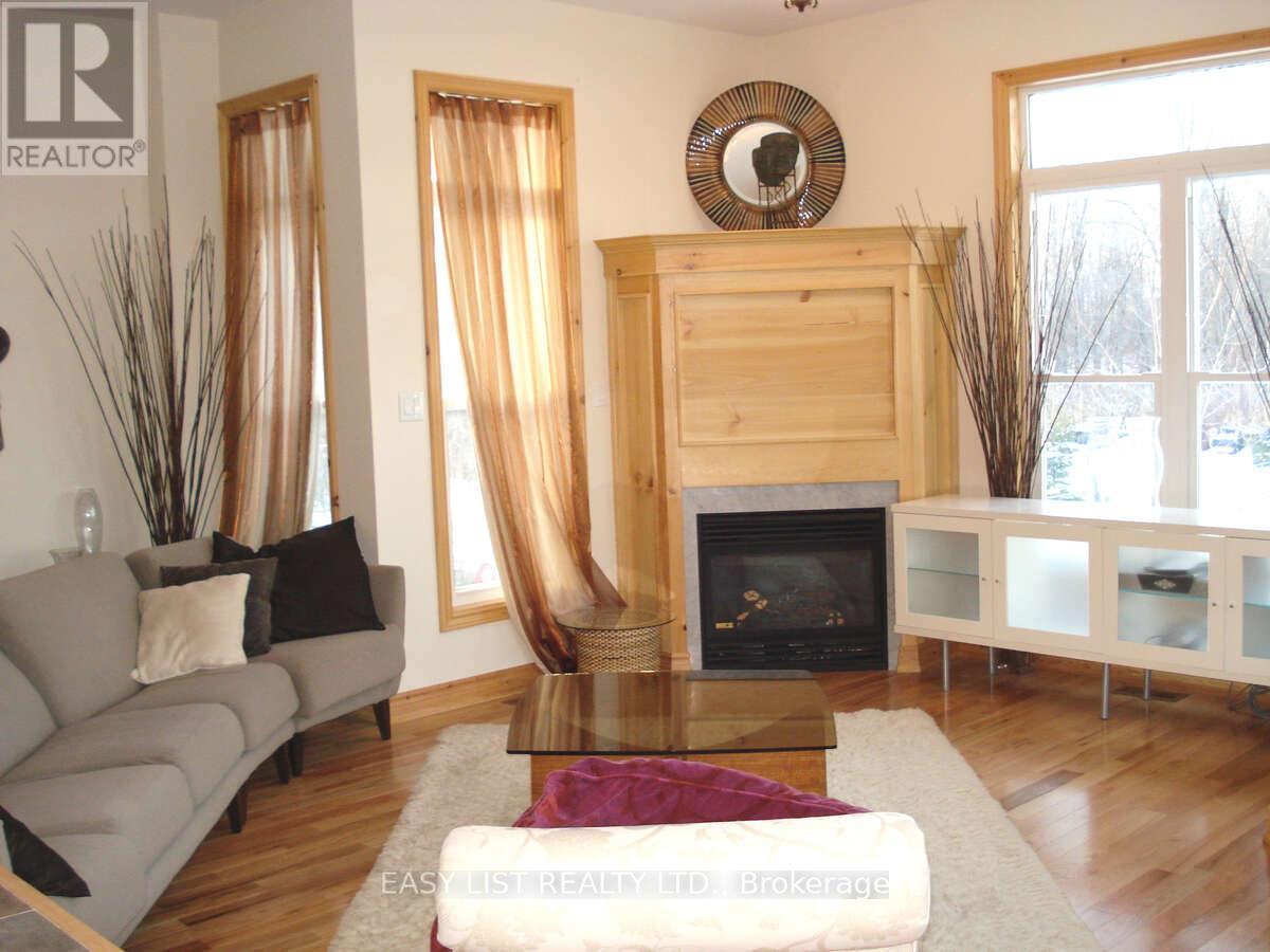 A living room with a fireplace and a couch.