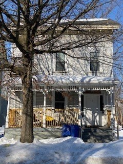 A house with a tree in front of it.