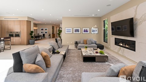A modern living room with a grey sofa and a coffee table.