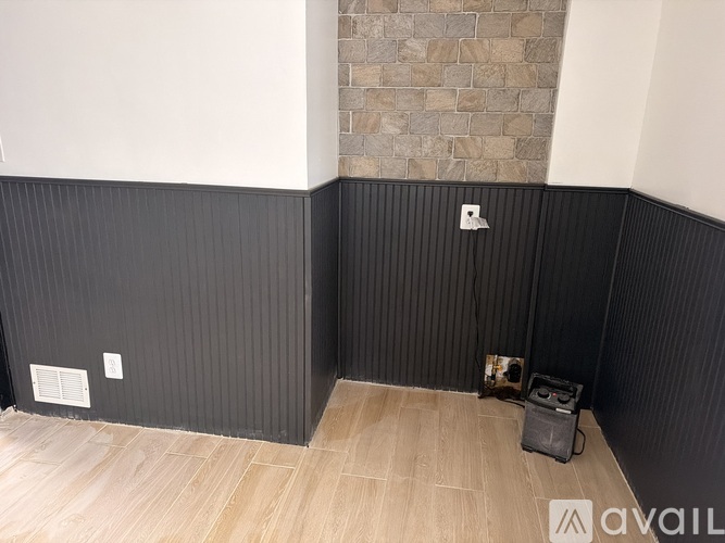 A room with a speaker on the floor.