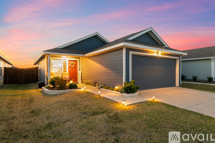 A house with a garage is available for sale.