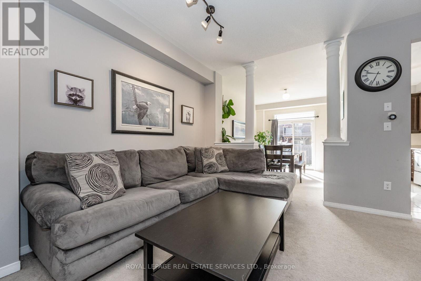 A living room with a grey couch and a coffee table.