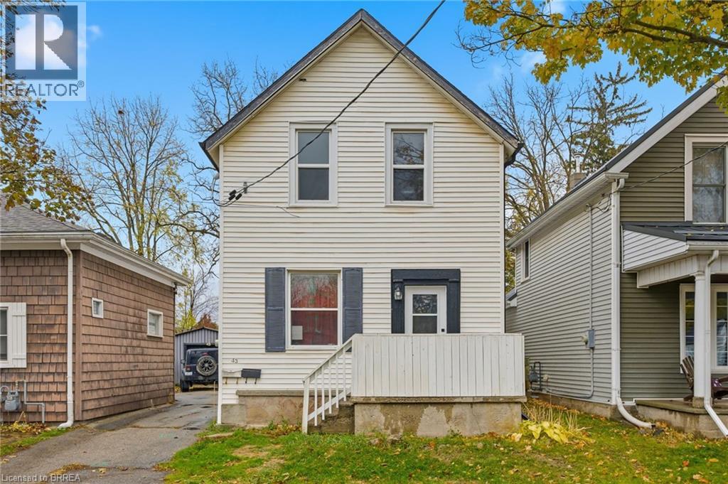 A two-story house with a garage is for sale.