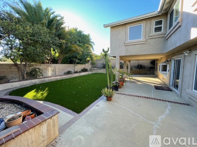 A house with a garden and a pool.