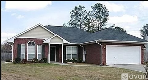 A house with a red brick exterior and a white garage door.