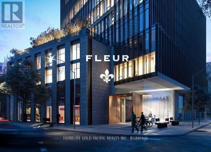 A modern building with the word "FLEUR" prominently displayed on the front.