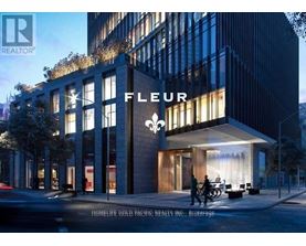 A modern building with the word "FLEUR" prominently displayed on the front.