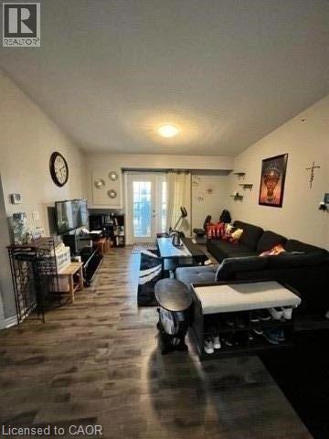 A living room with a couch, a chair, and a coffee table.