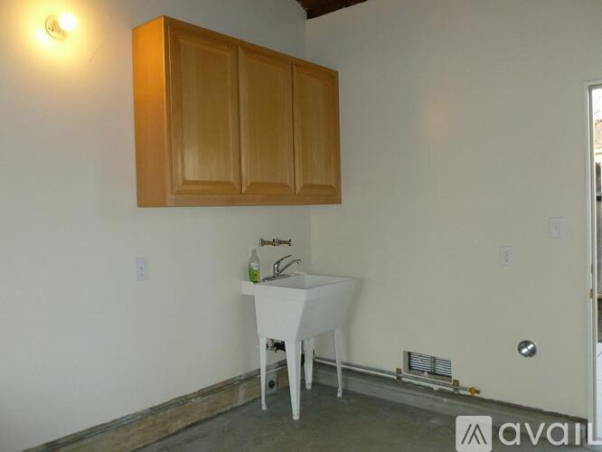 A small dining area with a white table and chairs.