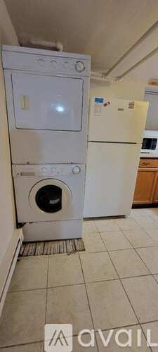 A white oven and refrigerator in a kitchen.