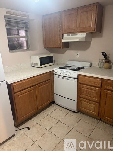 A white oven and refrigerator in a kitchen.
