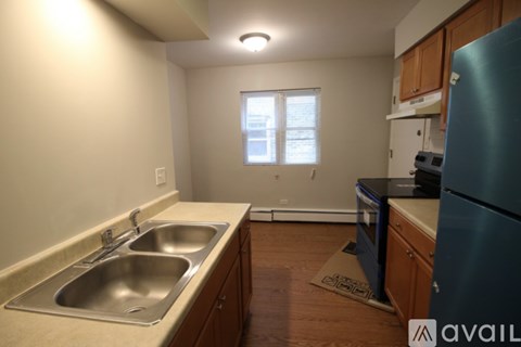 A kitchen with a sink and a window.