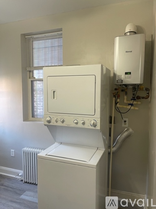 A white oven and stove top in a kitchen.