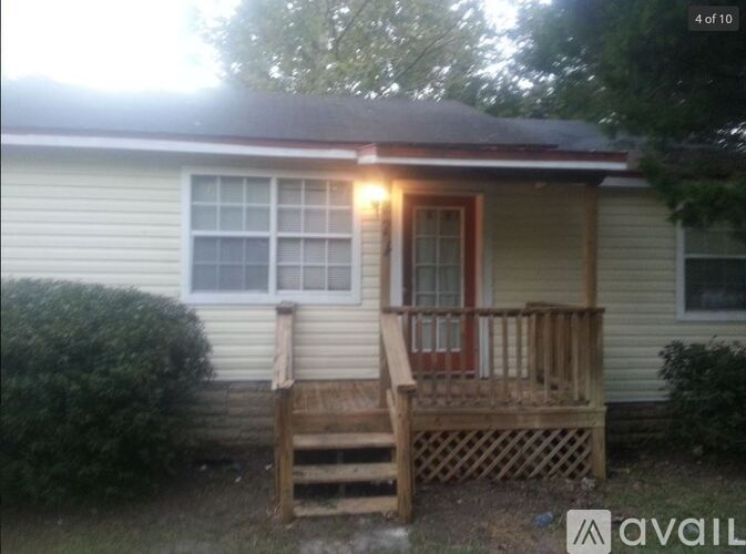 A house with a porch and a window.
