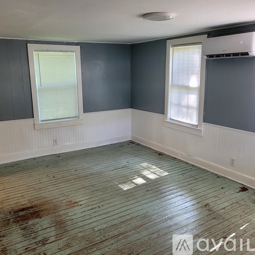 A room with a window and a wall with a window.