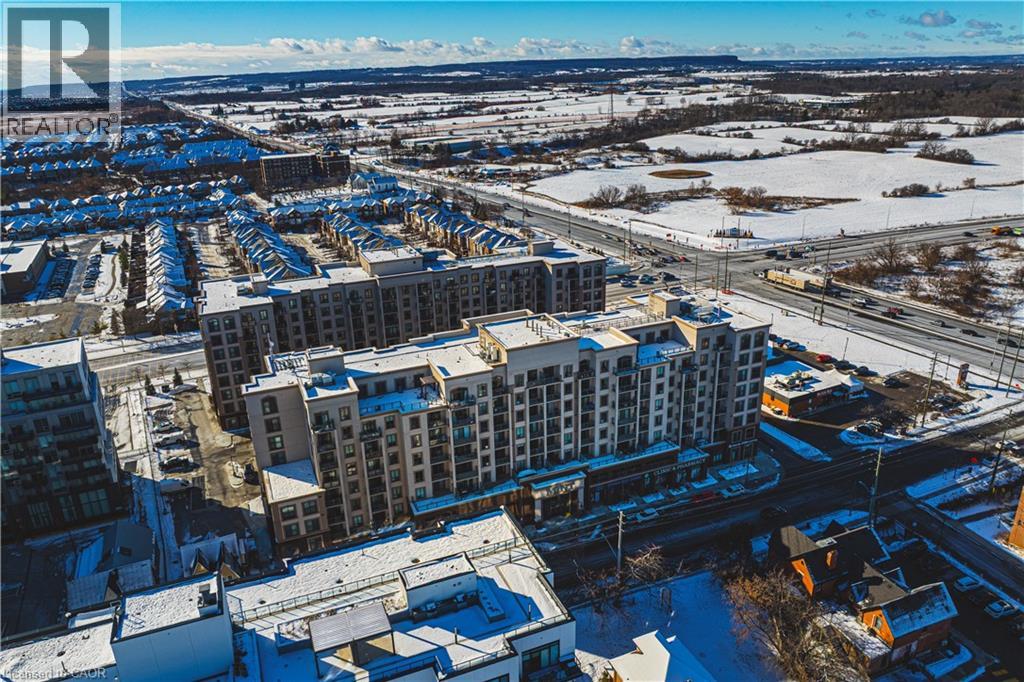 A winter scene of a city with buildings and roads.