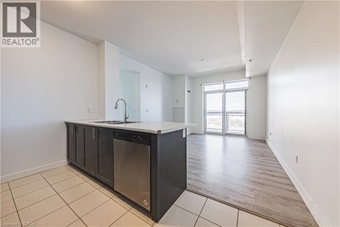 A kitchen with a sink and a dishwasher.