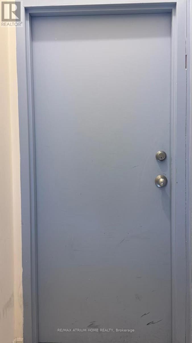 A blue door with a handle and a lock.