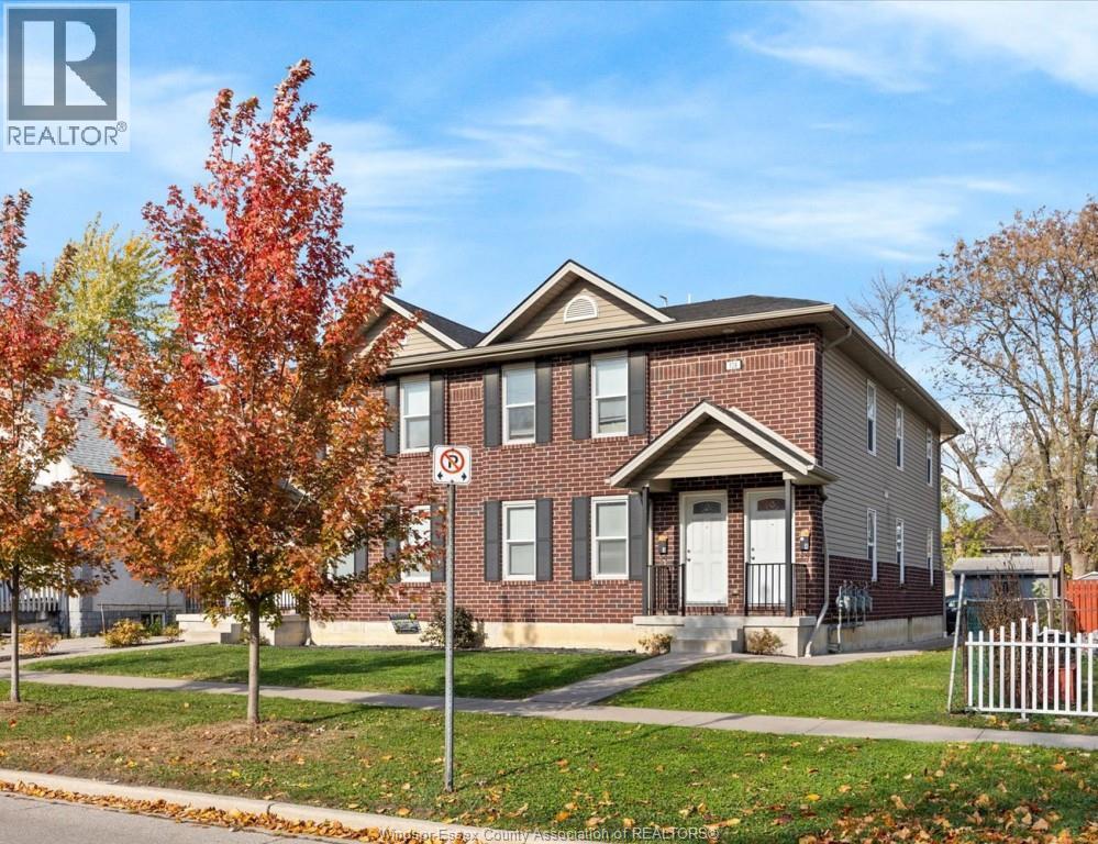 A house with a REALTOR® sign in front of it.