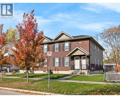 A house with a REALTOR® sign in front of it.