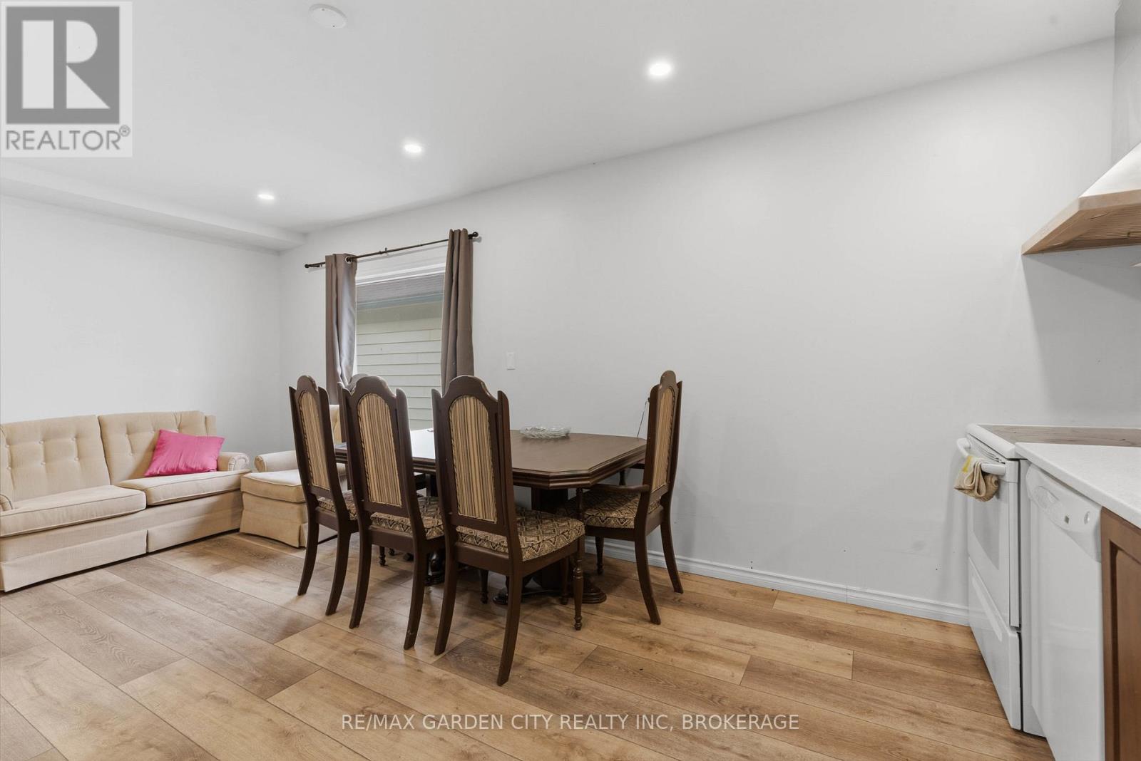 A dining room with a table set for four.