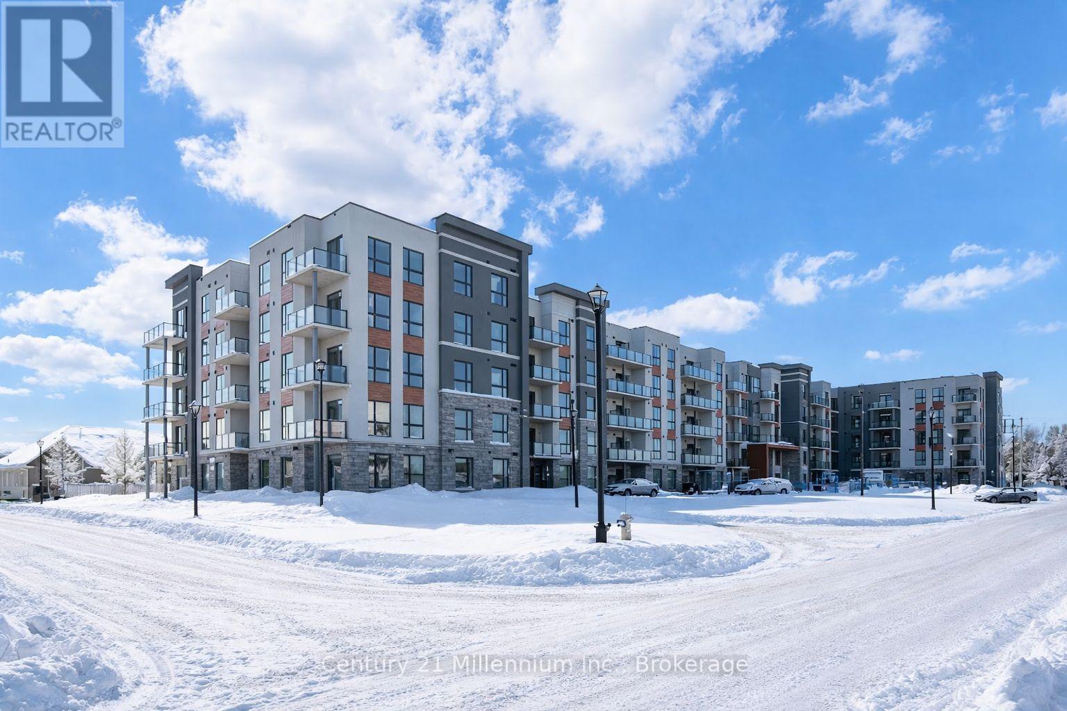 A large building under construction with a clear blue sky above.