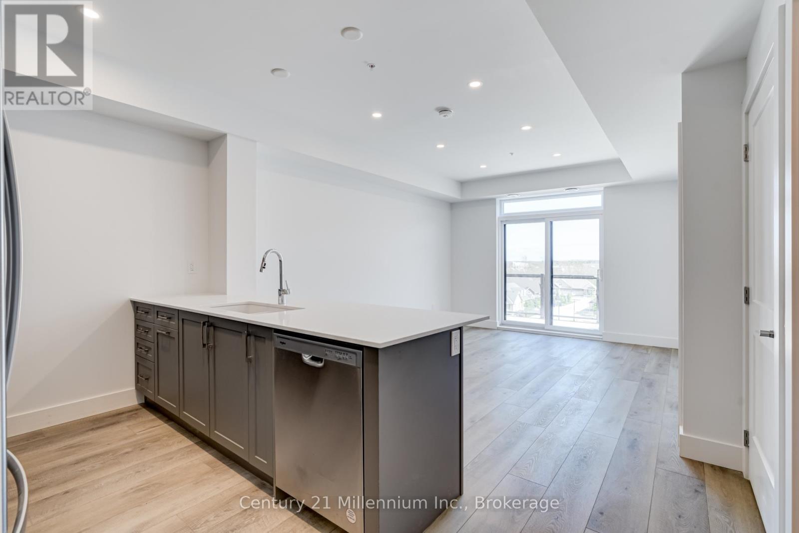 A kitchen with a sink and cabinets.