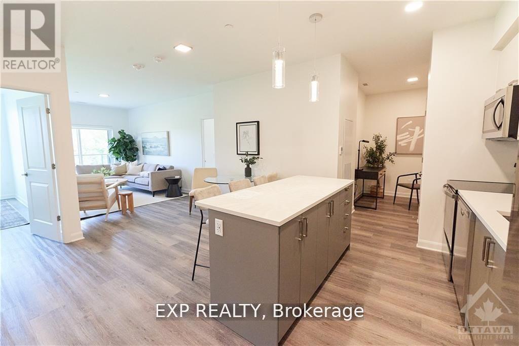 A well-lit kitchen with a dining table and chairs.