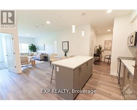 A well-lit kitchen with a dining table and chairs.