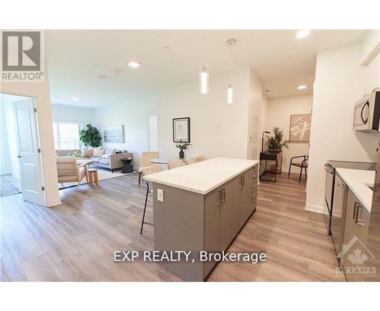 A well-lit kitchen with a dining table and chairs.
