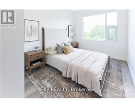 A bedroom with a large bed and a wooden nightstand.
