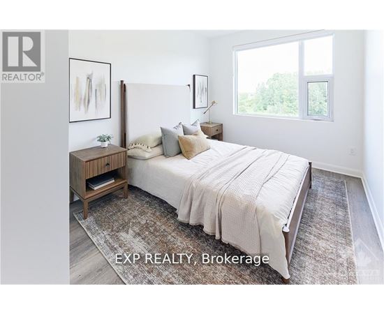 A bedroom with a large bed and a wooden nightstand.