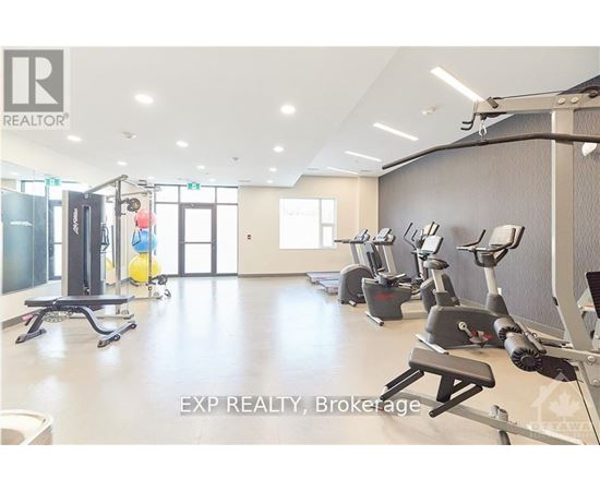 A gym with a variety of exercise equipment including treadmills, stationary bikes, and weight machines.