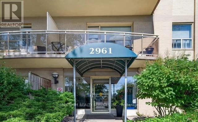 A building with a balcony and a sign that reads "2961" is shown.