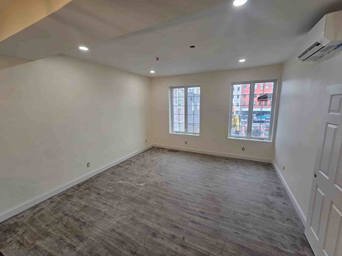 A room with a window and a door.