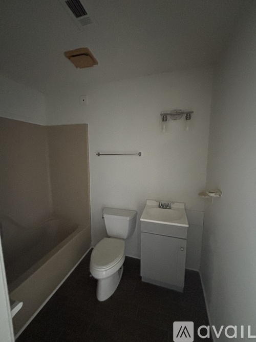 A small bathroom with a toilet and sink.