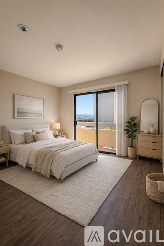 A bedroom with a large bed and a view of the city.