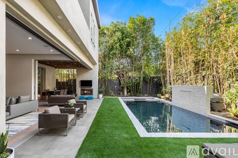 A modern house with a pool in the backyard.