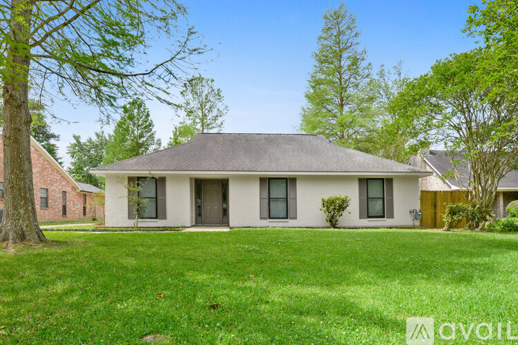 A house with a lawn in front of it is for sale.