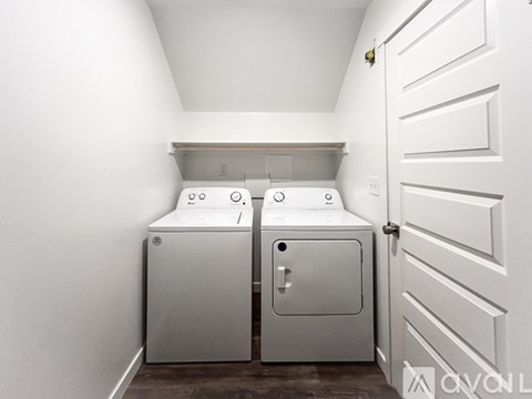 A white door is closed with a handle.