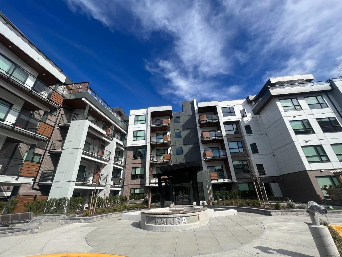 A modern apartment complex with a central courtyard.