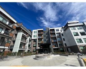 A modern apartment complex with a central courtyard.